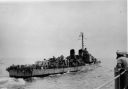 061_Off_Korea_-_USS_Brush_28DD-74529_being_escorted_by_Worcester_at_hitting_mine_Sept_26_1950.jpg
