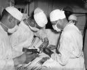 069_Off_Korea_-_Aiding_wounded_from_US_Brush_Sept_26_1950_28Hal_Brown_Photo29.jpg