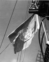 074_Off_Korea_Oct_1950_East_Coast_Bombardment_-_UN_Flag_from_Foretruck.jpg