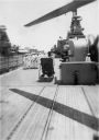020d_6-23-1951_Genoa_-_Looking_fwd_from_flight_deck_-_Adam_going_down_hatch_28Frank_Colletti29.jpg